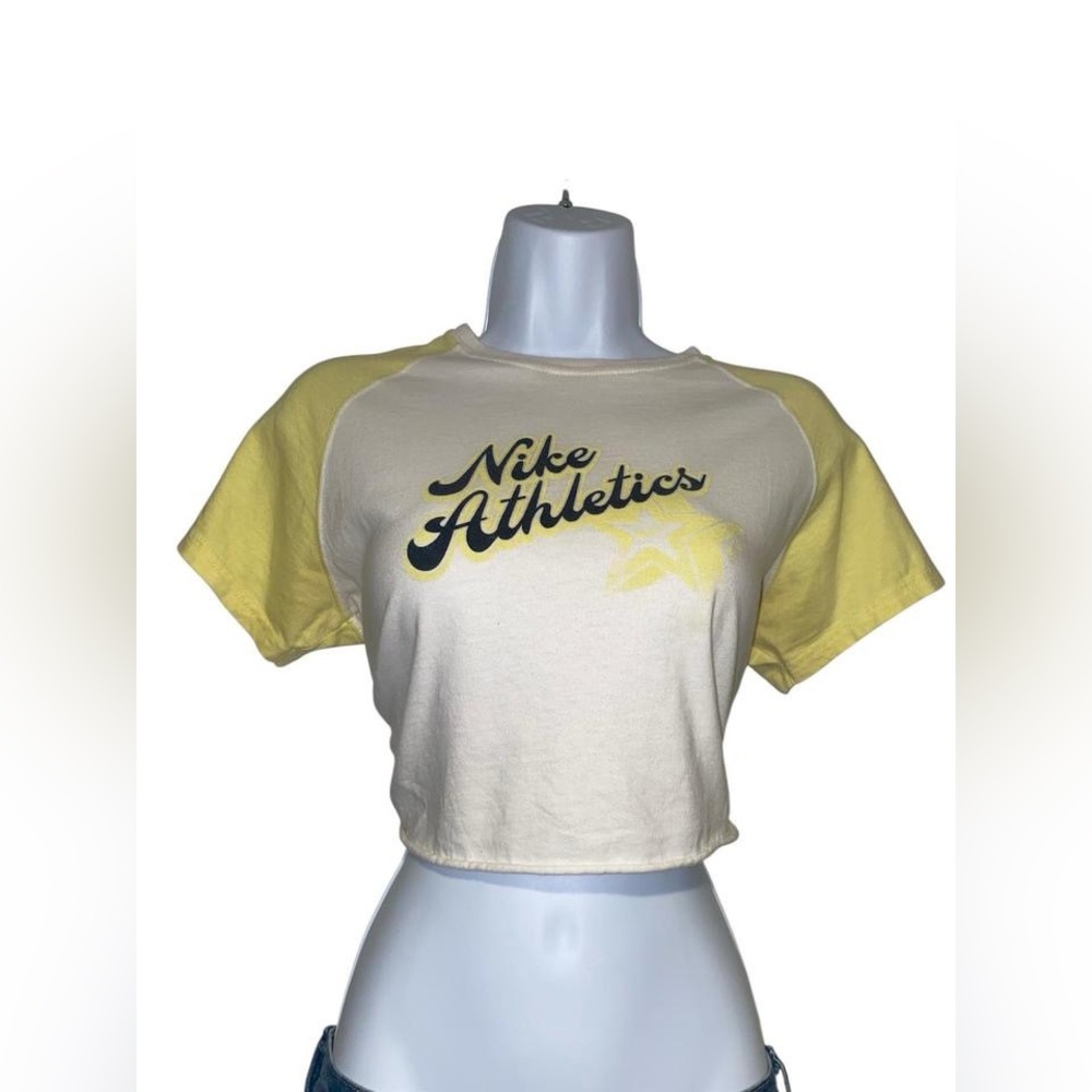 y2k nike white and yellow retro style cropped graphic baby tee